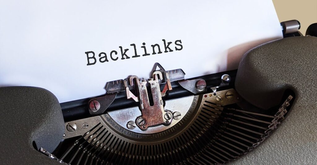 Close-up of a vintage typewriter printing the word 'Backlinks,' emphasizing content and SEO concepts.
